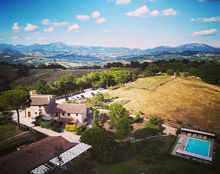 View from afar of the 17th century family villa in Umbria travel with kids to experience our family holidays